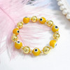 PULSERA OJO NARANJA - Piedras Bellisimas